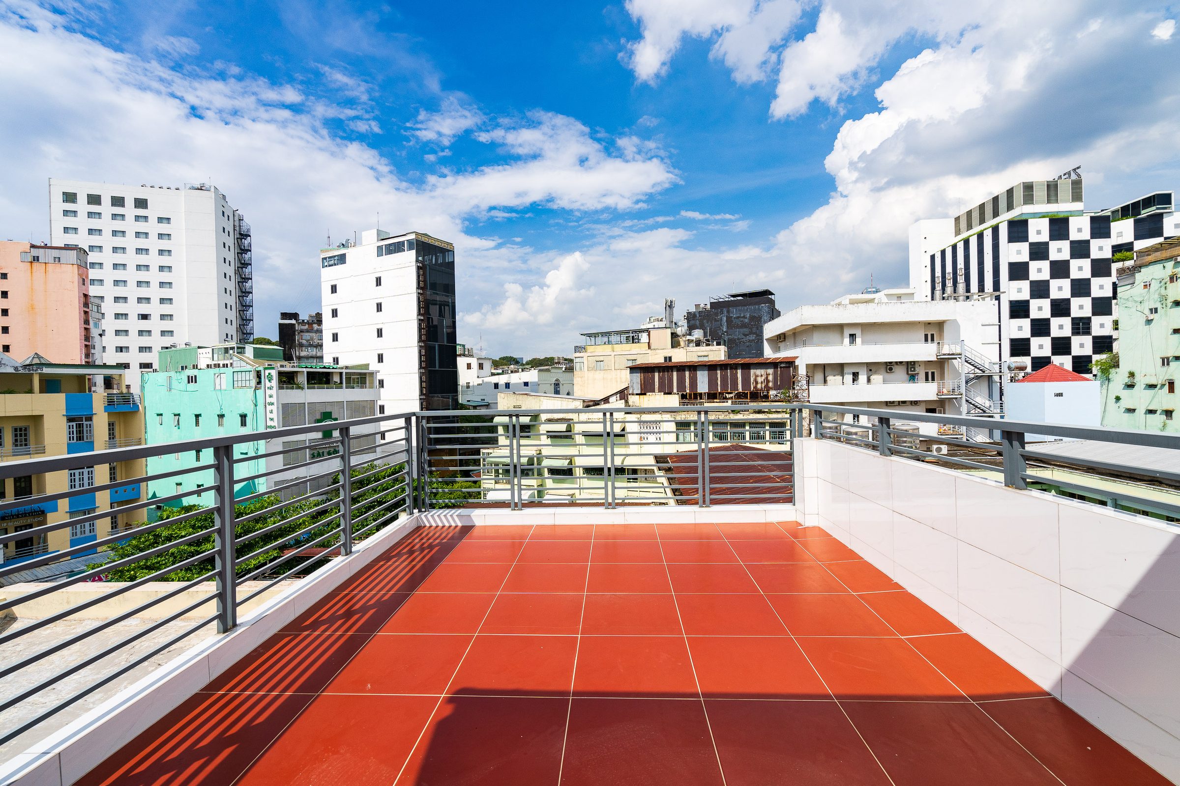 Rooftop terrace at Ekomo Home 95 - Metro Ben Thanh, overlooking District 1